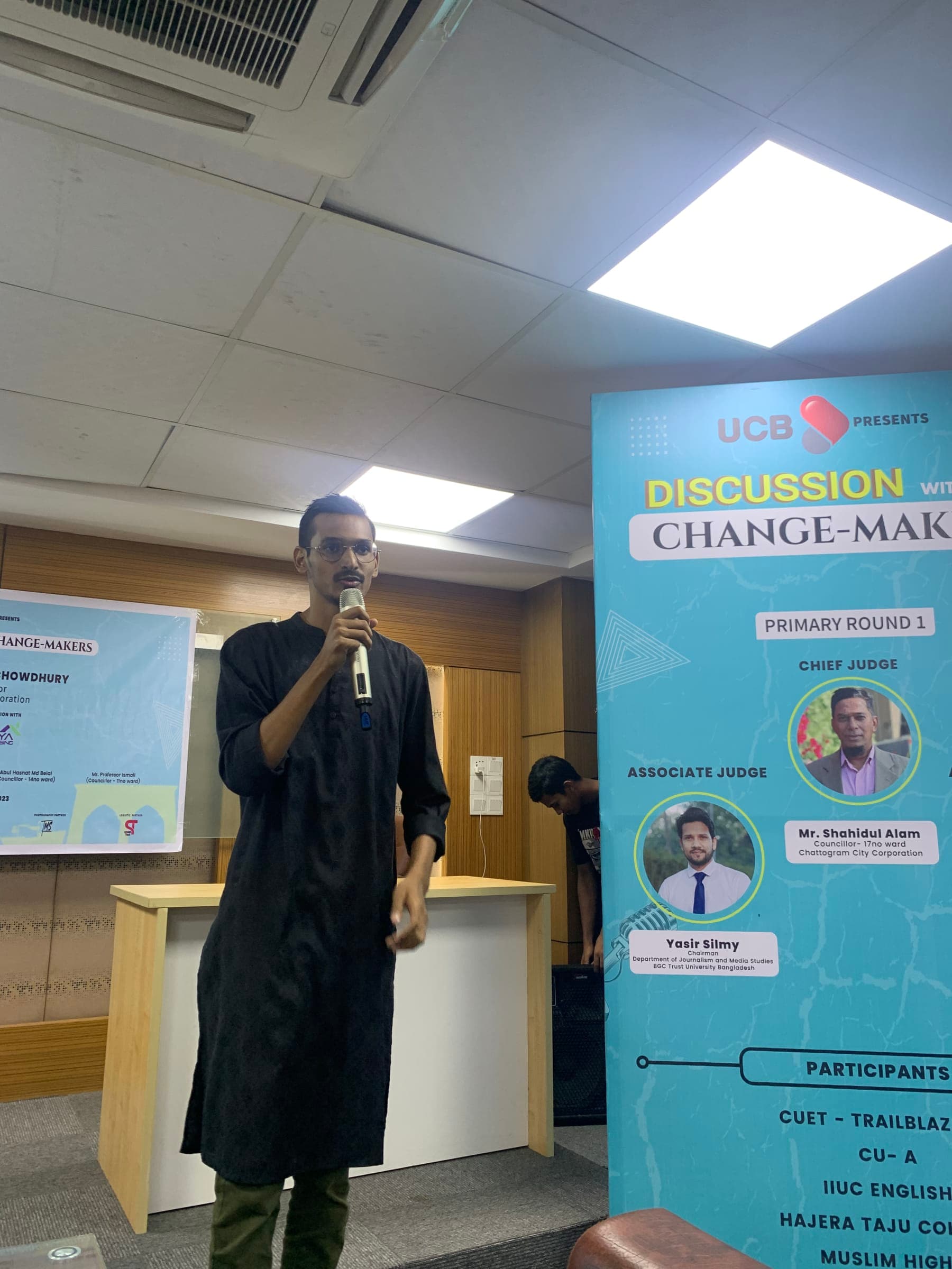 Ayman Siddique speaking at an event