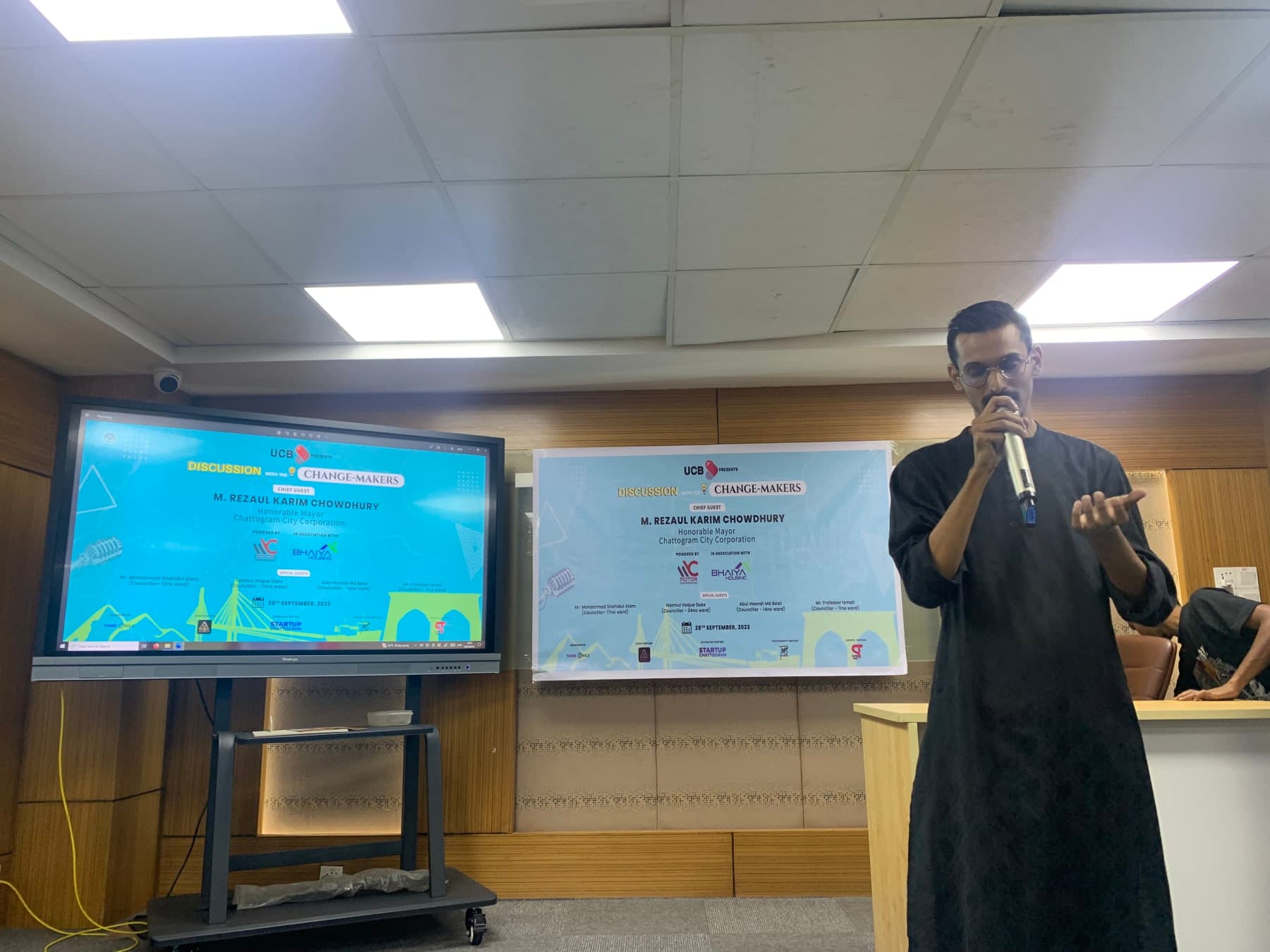 Ayman Siddique speaking at a session
